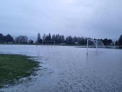 The road into the Memorial Park in Mosgiel has surface flooding and part of the sport ground looks like a lake.