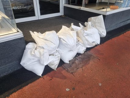 Sandbags line the entrances to businesses along Gordon Road, but plenty are open and trading this morning.